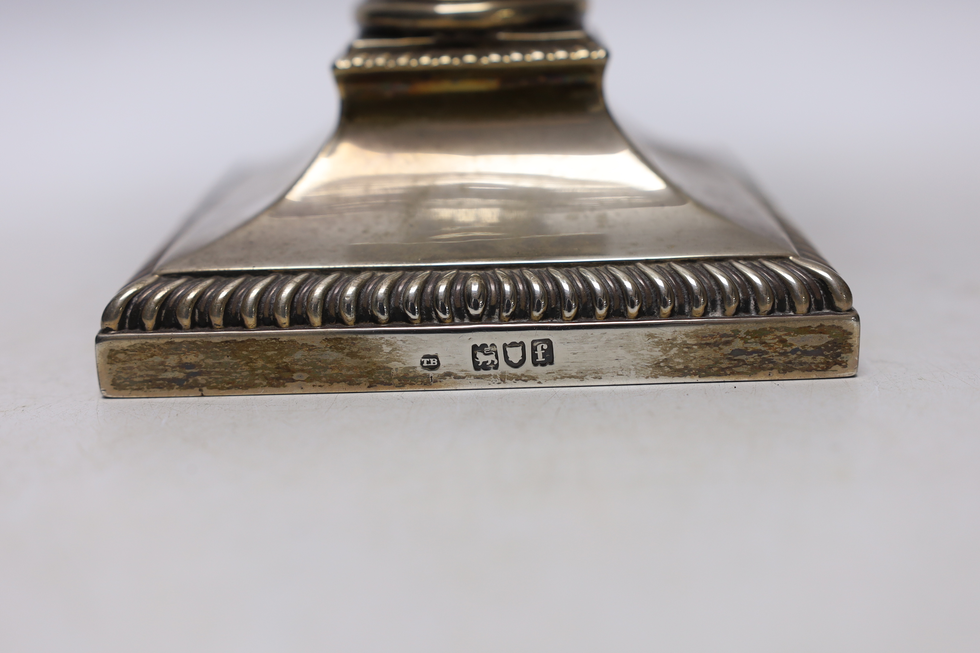 An Edwardian silver mounted Corinthian column candlestick, Thomas Bradbury & Son, London, 1901, 23cm, now with a silver plate mounted glass reservoir.